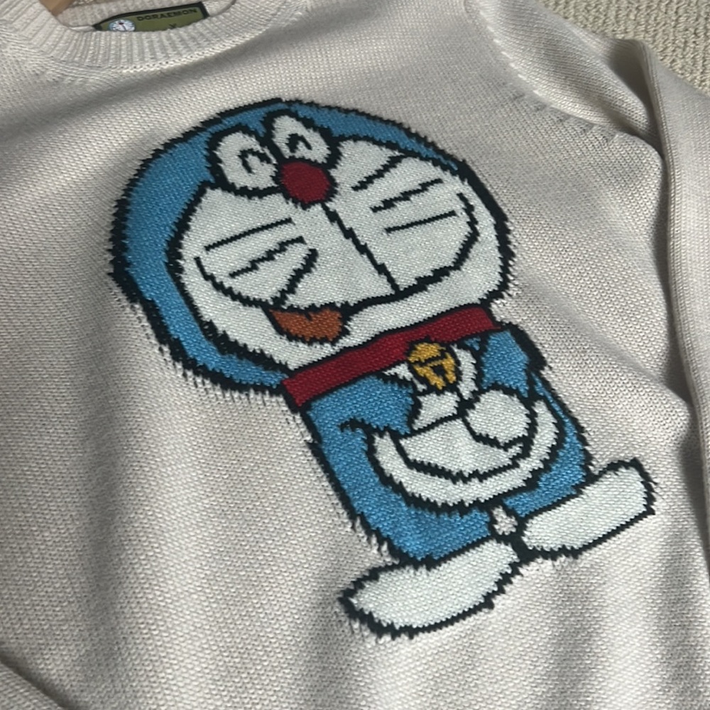 Blue and White Cartoon Character Sweater